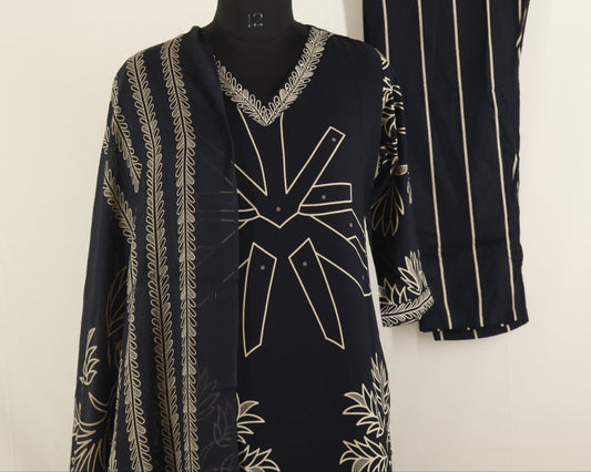 Black and white patterned dress on a mannequin and hanger against a white background